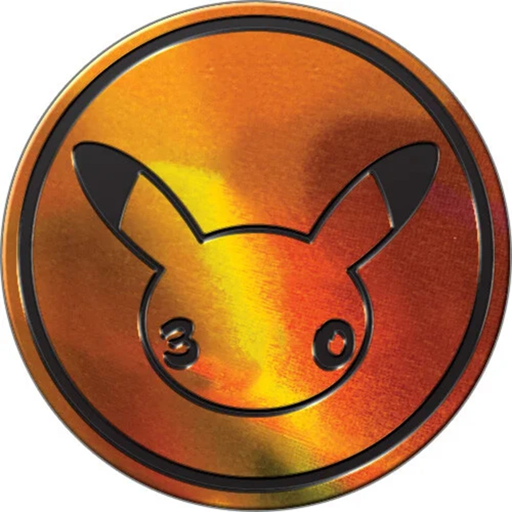 Close-up van de exclusieve gouden Pokémon 30th Celebration promo-munt met het speciale Pikachu jubileumlogo.