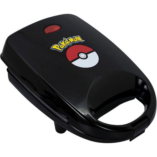 Zwarte Pokémon Tosti IJzer met een iconisch Pokéball design op de bakplaten voor het bereiden van gevulde sandwiches