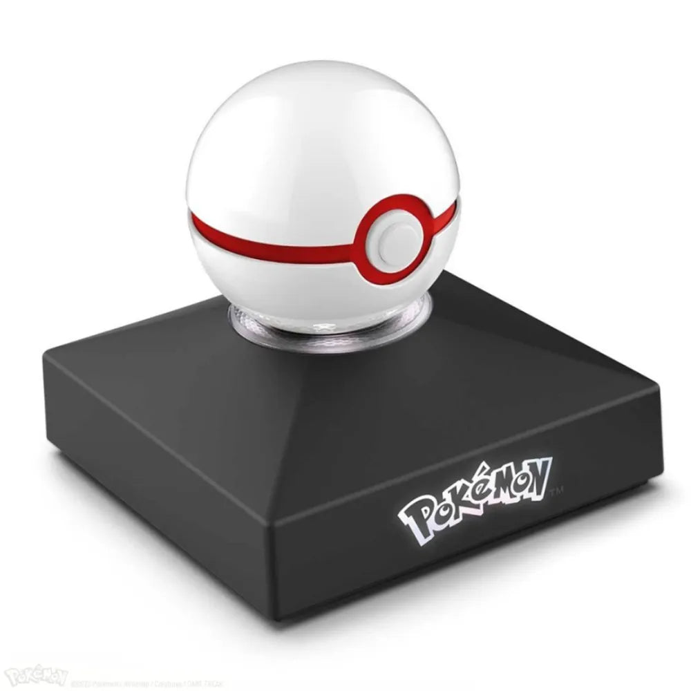 The Wand Company Pokémon Mini Premier Ball Replica in luxe witte en rode metaalfinish met verlichte displaystandaard - vooraanzicht